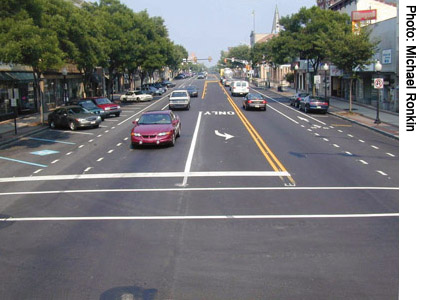(After) Pottstown’s Main Street after repaving and implementation of a road diet now has travel and bicycle lanes, a center left-turn lane, and parallel parking on one side changed to back-in diagonal parking. Increasing parking can help local businesses attract shoppers.
