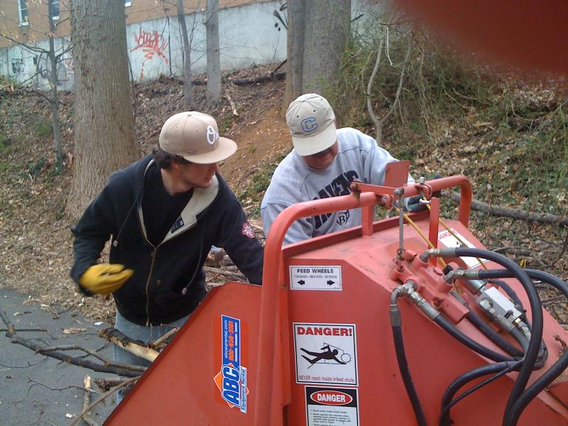 Rick and Andrew Smith feed chipper